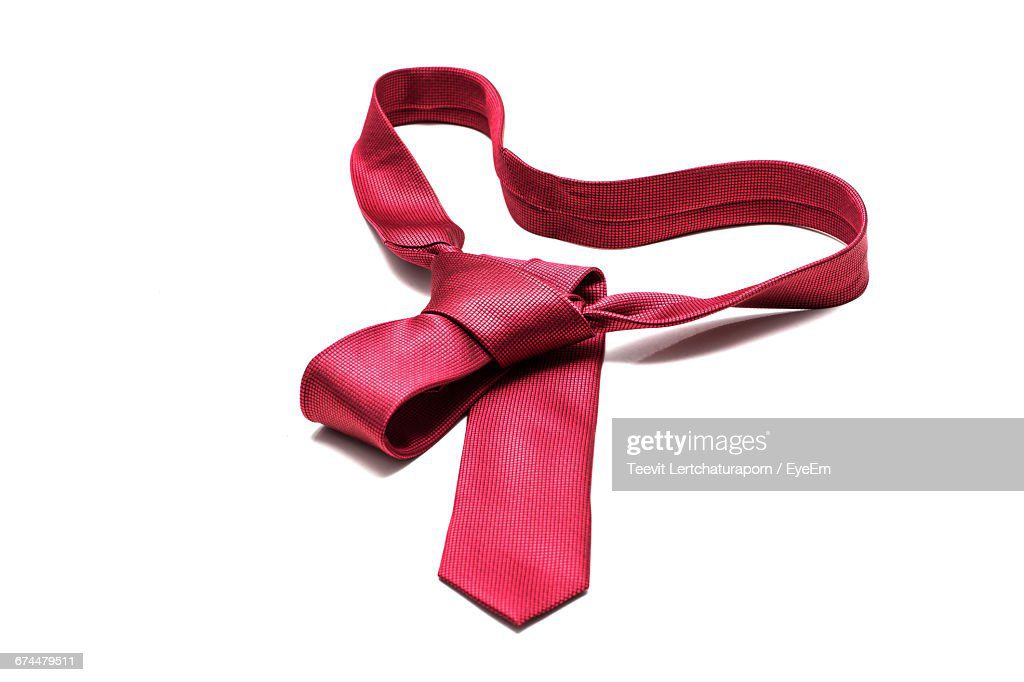 high angle view of red necktie on white background - corbata fotografías e imágenes de stock