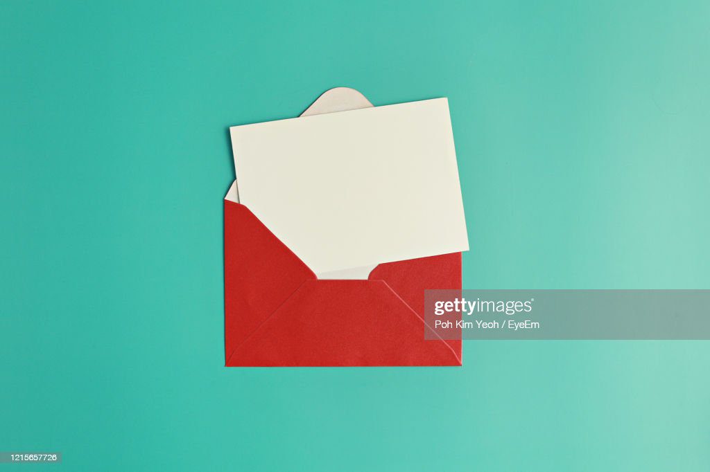 close-up of paper against blue background - sobre fotografías e imágenes de stock