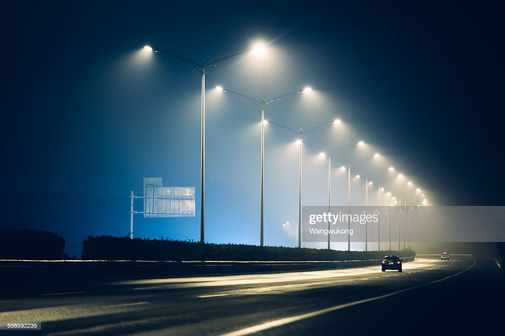 the highway lamps - farola fotografías e imágenes de stock