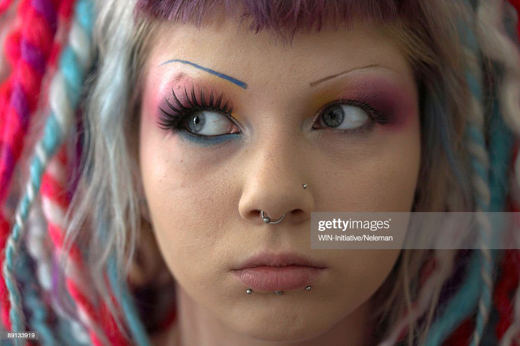 close-up of a woman's face with make-up and facial piercings, kiev, ukraine - piercing fotografías e imágenes de stock