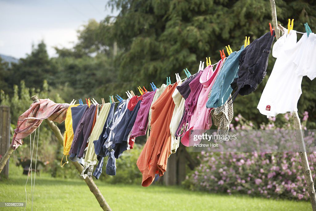 colourful washing on a clothes line - ropa tendida fotografías e imágenes de stock