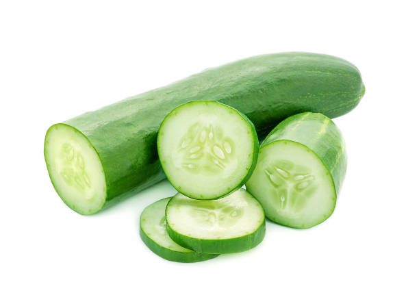 close-up of cucumber against white background - pepino fotografías e imágenes de stock
