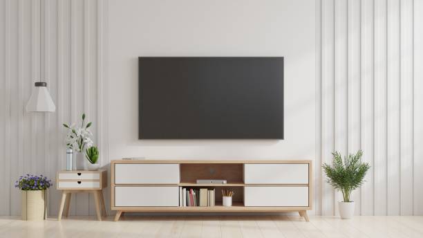 television set on wall at home - televisor fotografías e imágenes de stock