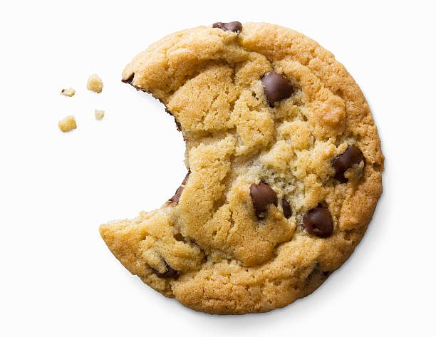 single chocolate chip cookie - mordida fotografías e imágenes de stock